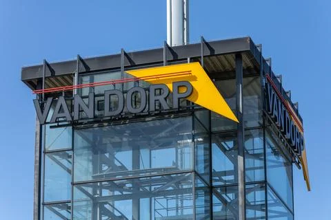 The Van Dorp logo with its distinctive yellow arrow is displayed on a modern Stock Photos