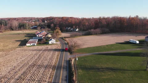 Van Drives Down Small Town Road in Pennsylvania 4k Stock Footage 145563687