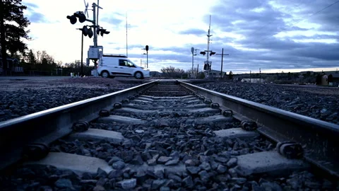 Van Drives Over Train Tracks at Sunrise Stock Footage 136054117