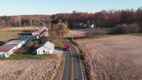 Van Drives Up Small Town Road in Pennsylvania Overhead 4k Stock Footage 145563653