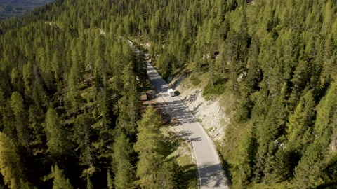 Van driving on beautiful mountain road on sunny day. Stock Footage 143366675