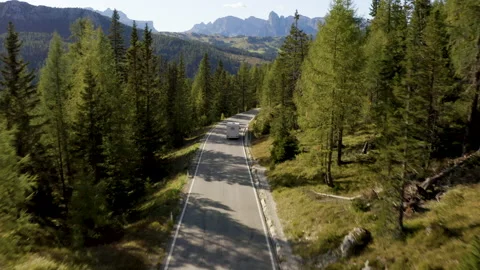 Van driving on beautiful mountain road on sunny day. Stock Footage 143366679