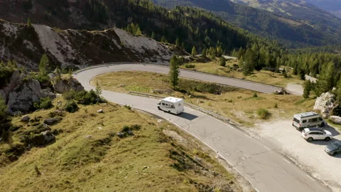 Van driving on beautiful mountain road on sunny day. Stock Footage 143367324
