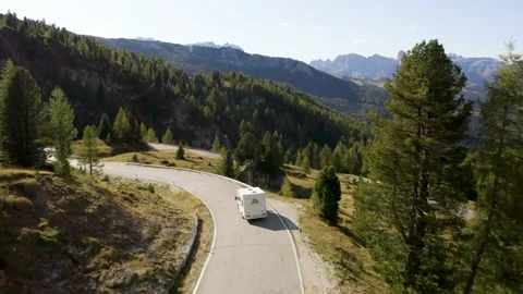 Van driving on beautiful mountain road on sunny day. Stock Footage 143367655