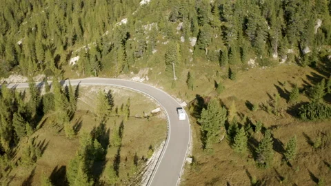 Van driving on beautiful mountain road on sunny day. Stock Footage 143368703