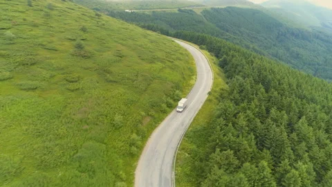 Van driving down the mountain road Video stock 135668512