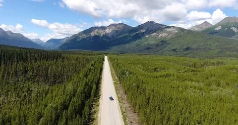 A van is driving on an empty wild street in the middle of nowhere Stock Footage 86196812