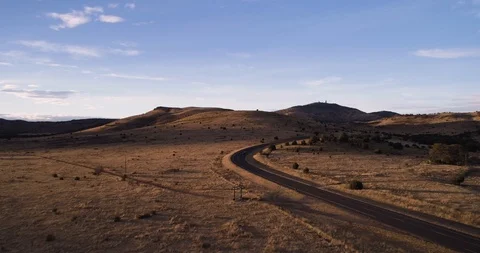 Van driving with landscape lit at sunset with observatory drone aerial 4K Stock Footage 111315779