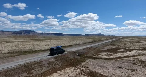 Van driving on a lonely road Stock Footage 86129764