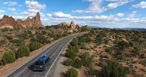 Van driving through a dessert street in Utah USA Stock Footage 86153602