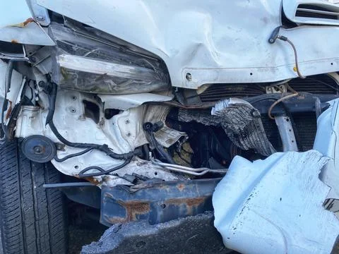 Van front damaged due to accident - Automotive insurance coverage concept Stock Photos