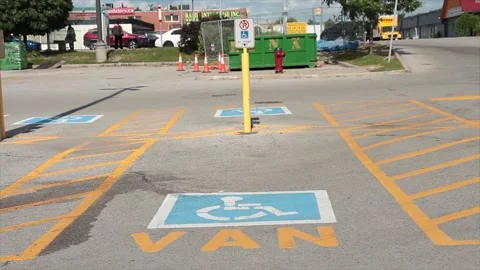 Van handicap parking space with van written text below handicap symbol, traffic Vídeo Stock 249097306