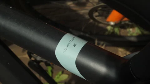 Van Moof name, logo on frame of model x3 bicycle. Close up. Stock Footage 246363830