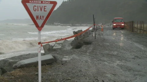 Van on narrow eroding road Stock Footage
