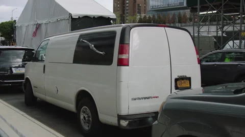 van parallel parked at covid 19 testing site in nyc Stock Footage 251198935