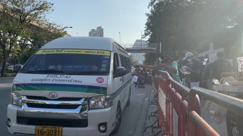 Van park at Chatuchak Park MRT station. POV van driver buy food from vendor Stock Footage 176842149