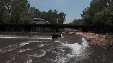 Van passes over scenic river Stock Footage 289696948