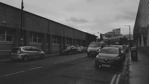 A van passing the camera on a tight city street Video stock 171835984