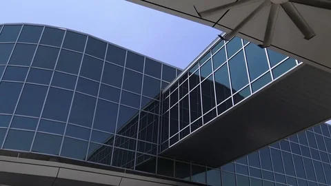 Van pulls up outside blue crosswalk on building with fan running Video stock 76480494