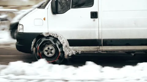 Van with snow chains on frozen road Stock Footage 59757901