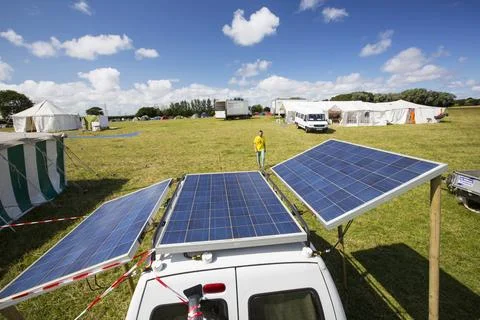 A van with solar panels attached at a protest against fracking at a farm site Stock Photos