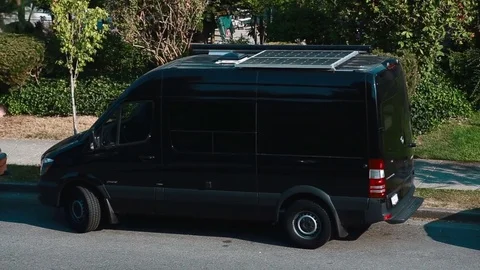 A van with solar panels on the roof Stock Footage