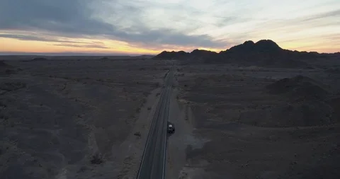 Van stopped at the side of the road with sunset drone aerial 4K Stock Footage 111310051