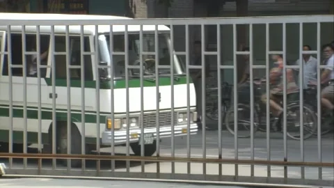 The van turns into the gate Stock Footage 253772385