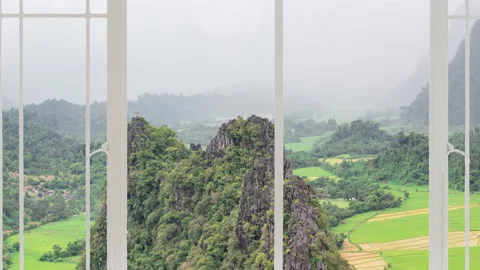 Van Vieng cityscape as seen from a white window Stock Footage 140857207