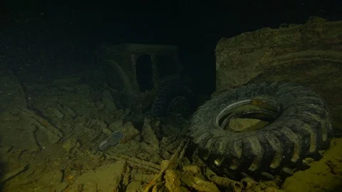 Van wheel in the hold of the shipwreck Thistleghorm, Red Sea, Egypt Stock Footage 105461461
