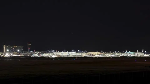VANCOUVER, BC, CANADA - JULY 27, 2023: Time lapse YVR airport at dusk with main Stock Footage 249727231