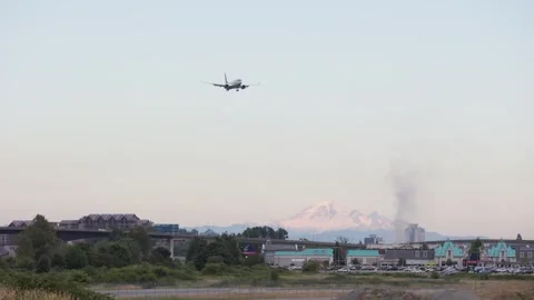 VANCOUVER, BC, CANADA - JULY 27, 2023: 737 aircraft approaching YVR with Mount Stock Footage 249727688