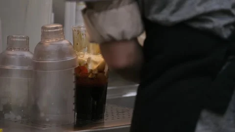 Vancouver Canada 05.05.2024 preparation of Bubble Tea drink made from brown Stock Footage 274470480