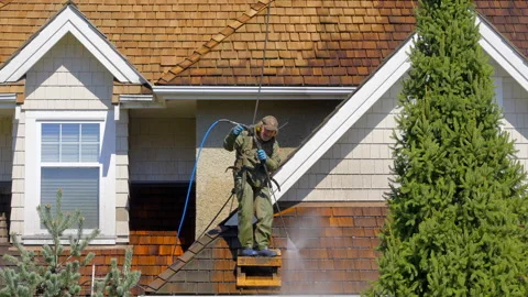 VANCOUVER, CANADA, MAY 12, 2022: ROOF CLEANING PROFESSIONAL WASHING ROOF Stock Footage 221184879
