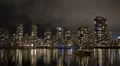 Vancouver condos time lapse night sky. False creek and boat in the foreground. HD Footage