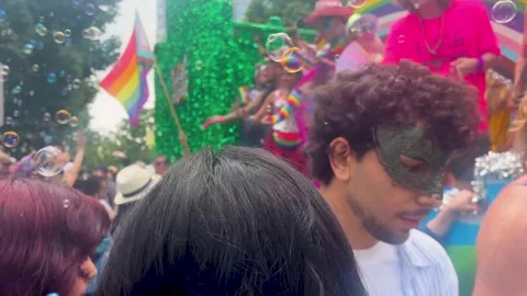 Vancouver Pride Parade float with crowd and bubbles Stock Footage 332579028
