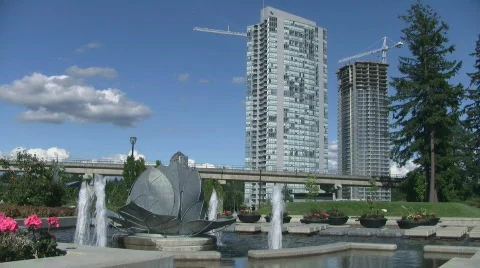 Vancouver (Surrey) Urban Park with Sky Train Transit System Stock Footage