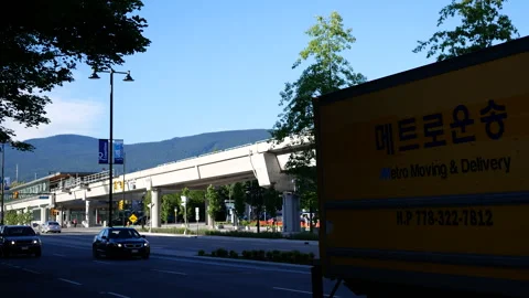 Vancouver Urban Transit Infrastructure with SkyTrain Bridge and City Traffic 스톡 동영상 339099089