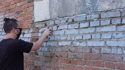 Vandal spray paint wall Stock Footage 138137392