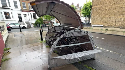 Vandalised secure bike storage pod on London street Stock Footage 336724968