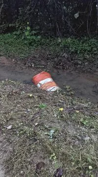 Vandalized Construction Barrel 库存照片