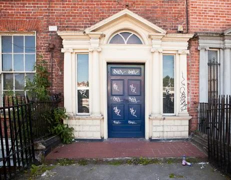 Vandalized door in dublin Stock Photos