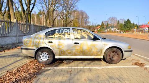 Vandalized silver car Stock Photos