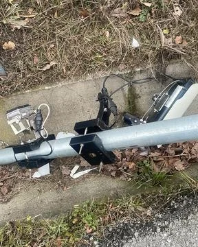 Vandalized speed camera equipment lying on the ground, representing a signi.. Stock Photos