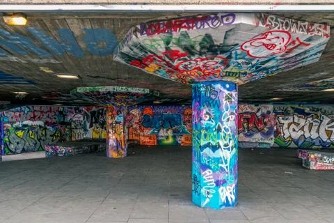 A vandalized underside of a concrete bridge Stock Photos