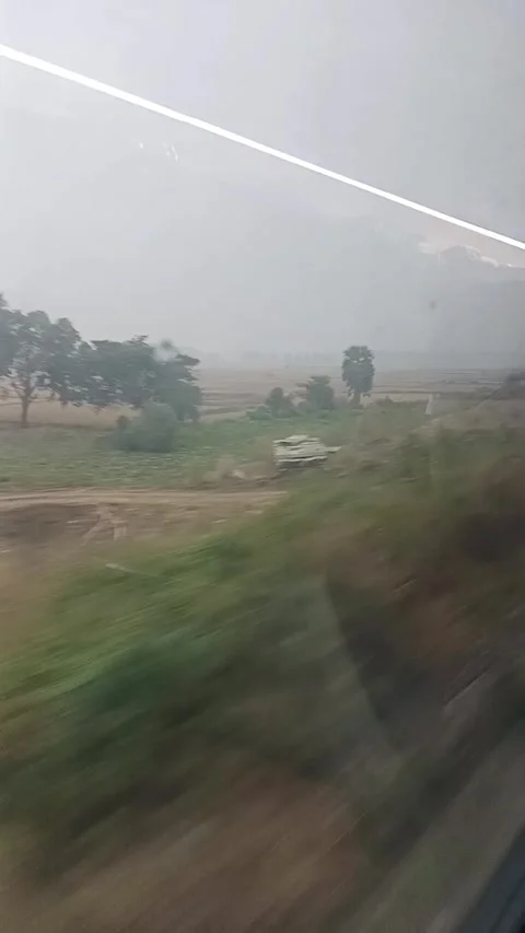 Vande Bharat Express Train Window View Rural Landscape Passing By Howrah To Puri Stock Footage 336243554