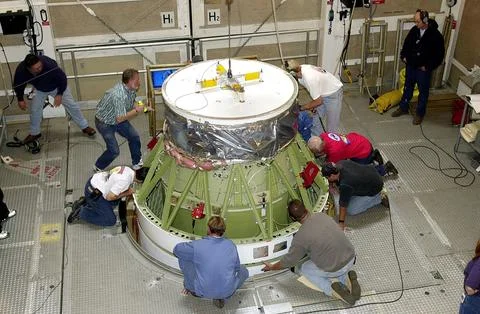 VANDENBERG AFB, CALIF. - Workers on the mobile service tower at Space Launc.. Stock Photos