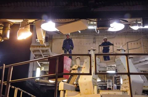 VANDENBERG AIR FORCE BASE, Calif. Workers roll the mobile service tower aw... Stock Photos