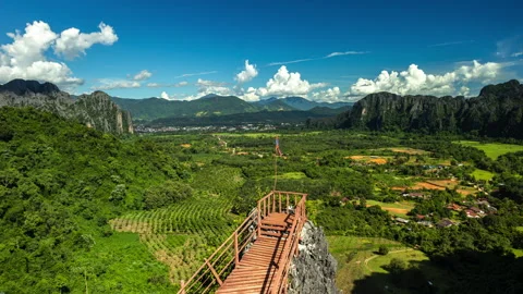 Vang Vieng, Laos Breathtaking highangle panoramic vista from wooden observation Stock Footage 318283041