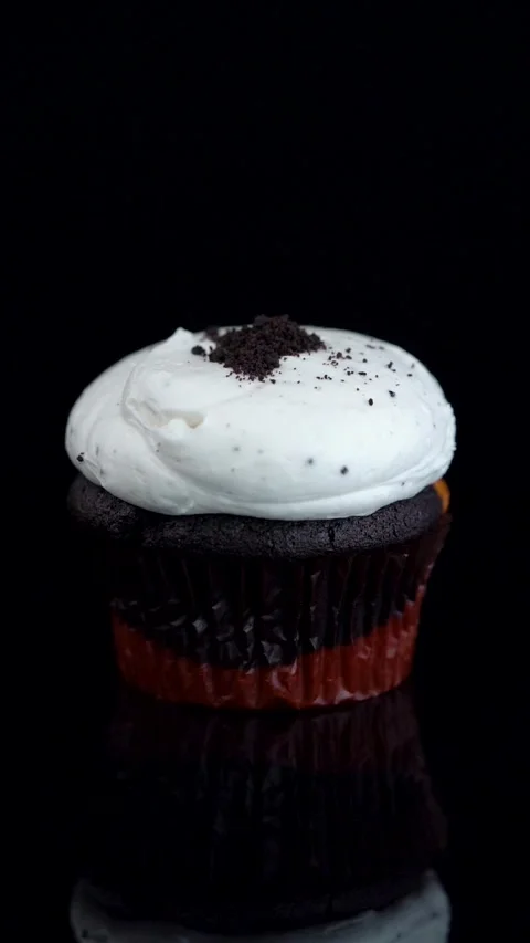 Vanilla and Dark Chocolate Cupcake with Oreo Crumbs Rotating Stock Footage 330516786